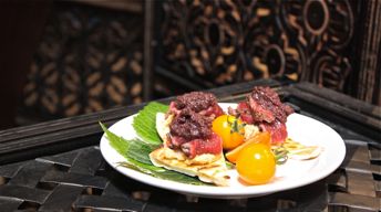 Pepper-Crusted Lamb with Hummus and Tapenade